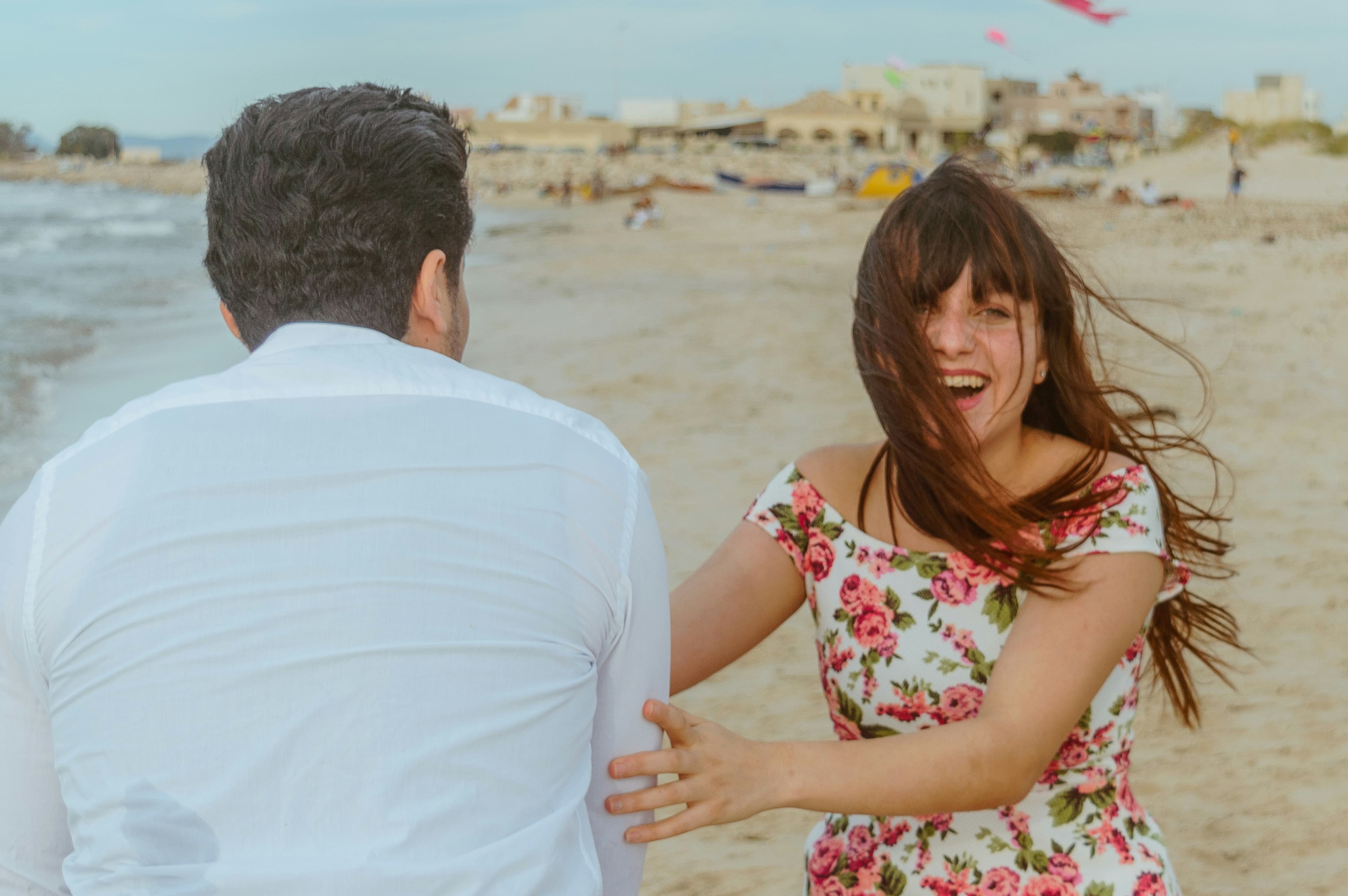 Couple on beach - thoughtful paper anniversary gifts for her